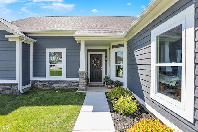 49 Manchester Dr, Trafalgar, IN 46181 - entrance to property with a yard, a shingled roof, and stone siding