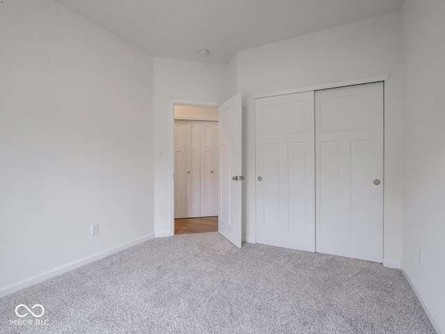 49 Manchester Dr, Trafalgar, IN 46181 - unfurnished bedroom featuring carpet flooring, a closet, and baseboards