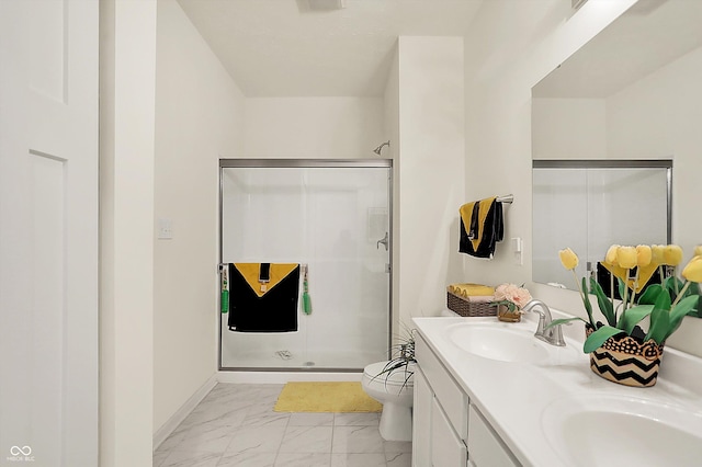 49 Manchester Dr, Trafalgar, IN 46181 - full bathroom featuring marble finish flooring, double vanity, a shower stall, and toilet