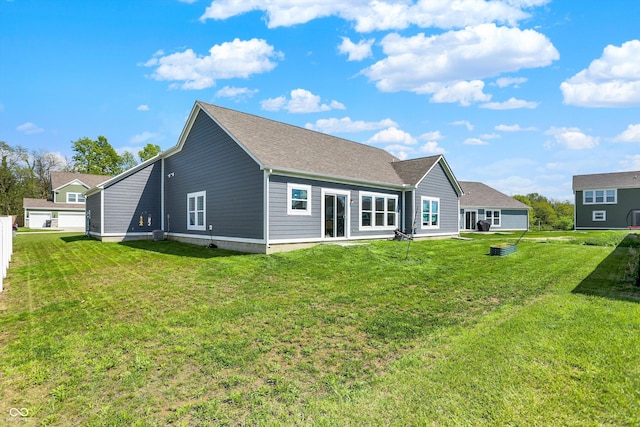 49 Manchester Dr, Trafalgar, IN 46181 - back of house with a yard and a shingled roof
