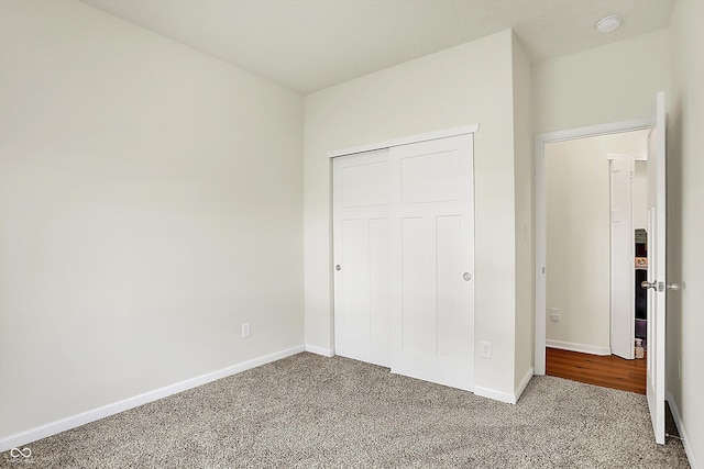 49 Manchester Dr, Trafalgar, IN 46181 - unfurnished bedroom featuring carpet, baseboards, and a closet