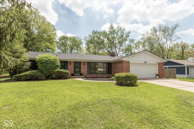 view of front of house with brick siding, concrete driveway, an attached garage, and a chimney