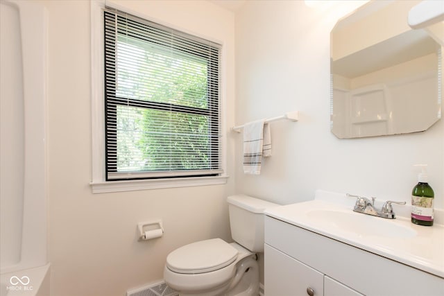 bathroom with toilet and vanity