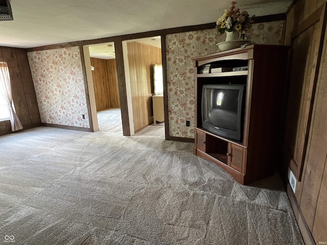1345 E County Road 300 S, New Castle, IN 47362 - unfurnished living room with wallpapered walls, carpet floors, plenty of natural light, and baseboards