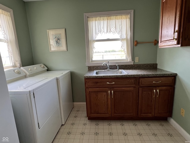 1345 E County Road 300 S, New Castle, IN 47362 - washroom featuring separate washer and dryer, cabinet space, baseboards, and light floors