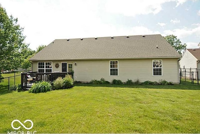 back of property featuring a wooden deck
