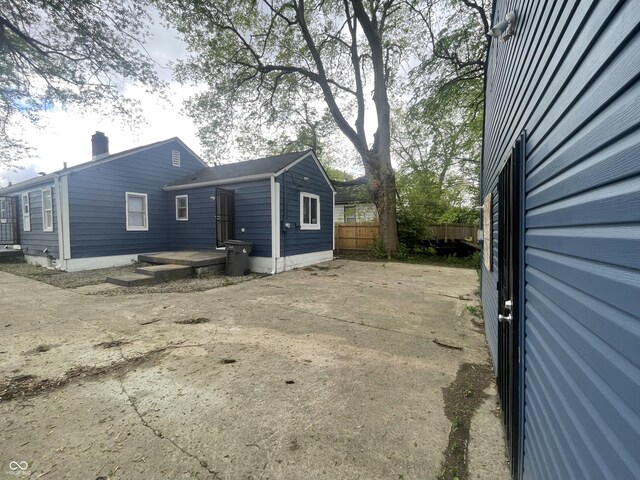 view of home's exterior with fence