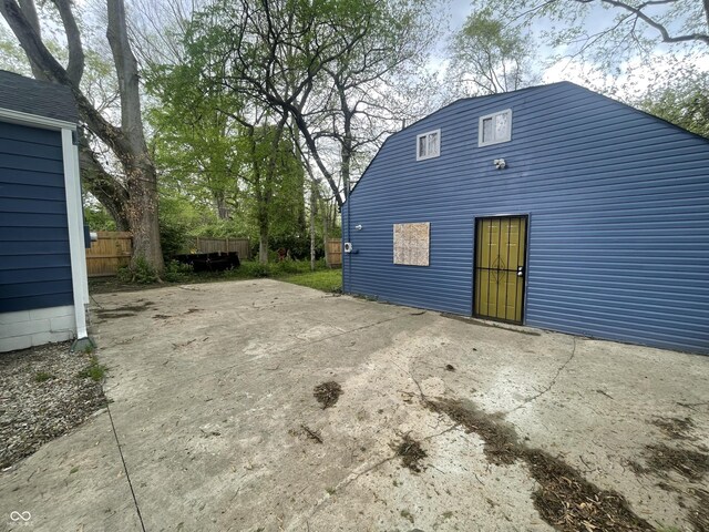 view of patio featuring fence