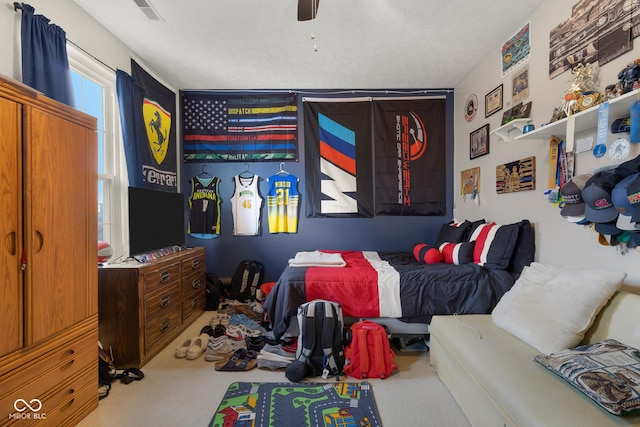 carpeted bedroom with ceiling fan