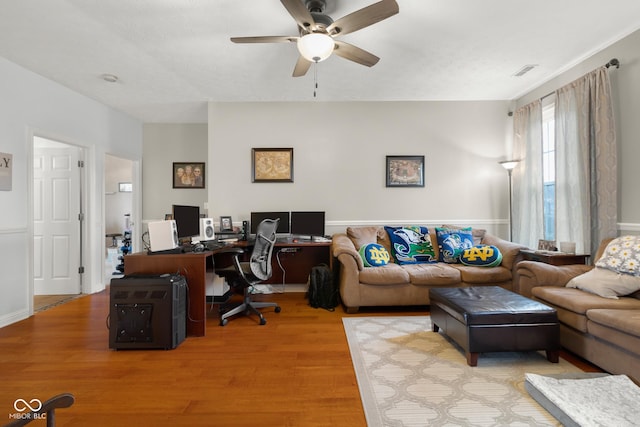 office with a ceiling fan and wood finished floors