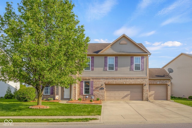 townhome / multi-family property with driveway, a front lawn, brick siding, and a garage