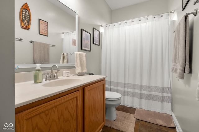 full bathroom with toilet, vanity, and a shower with curtain