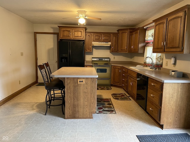 4706 W Old Trail Rd, Knightstown, IN 46148 - kitchen with black appliances, a sink, under cabinet range hood, light countertops, and a textured ceiling
