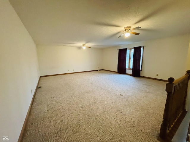 4706 W Old Trail Rd, Knightstown, IN 46148 - unfurnished room with a ceiling fan, light carpet, and baseboards