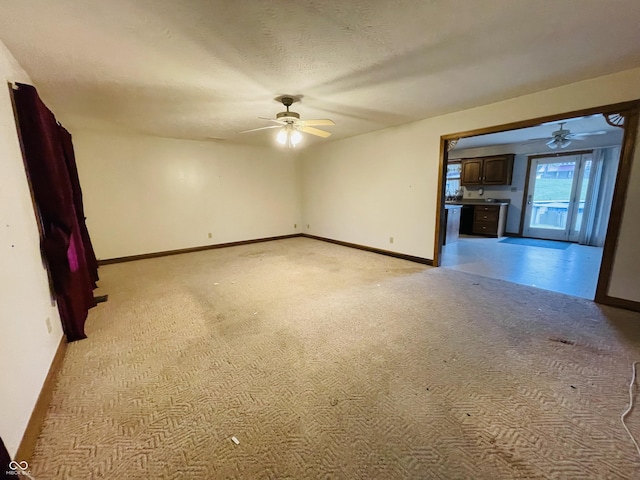 4706 W Old Trail Rd, Knightstown, IN 46148 - empty room with a ceiling fan, light carpet, and baseboards