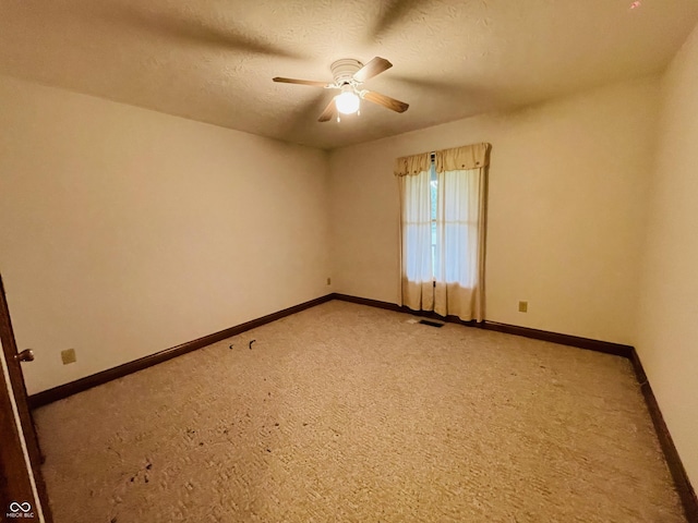 4706 W Old Trail Rd, Knightstown, IN 46148 - unfurnished room featuring ceiling fan, baseboards, light colored carpet, and a textured ceiling