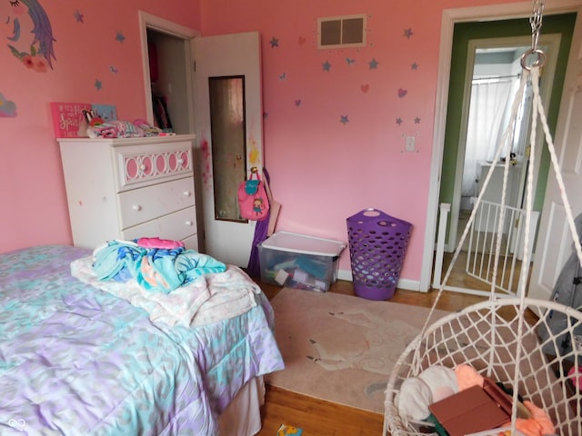2867 S Oakland Dr, Shelbyville, IN 46176 - bedroom featuring wood finished floors and baseboards