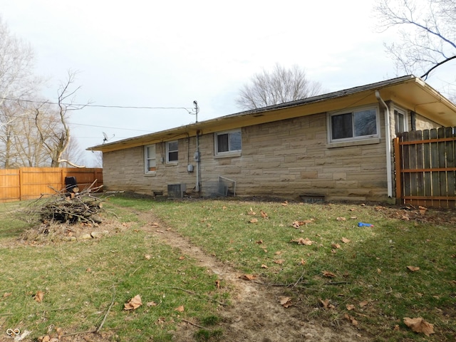 2867 S Oakland Dr, Shelbyville, IN 46176 - rear view of property featuring stone siding and central AC unit