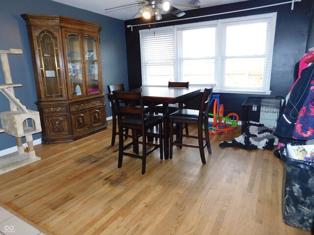 2867 S Oakland Dr, Shelbyville, IN 46176 - dining area featuring ceiling fan, light wood-style floors, plenty of natural light, and baseboards