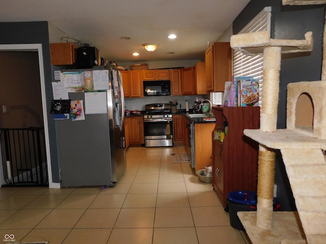 2867 S Oakland Dr, Shelbyville, IN 46176 - kitchen with stainless steel appliances, a sink, brown cabinets, light tile patterned floors, and recessed lighting