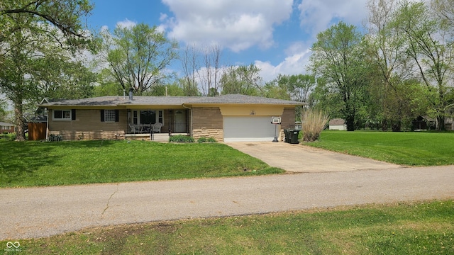 2867 S Oakland Dr, Shelbyville, IN 46176 - ranch-style home featuring a garage, stone siding, driveway, and a front yard