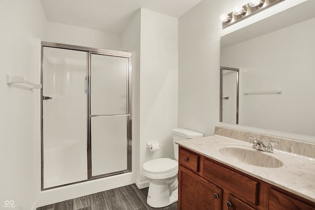 7156 Chemistry Ct, Indianapolis, IN 46239 - full bath with a shower stall, toilet, wood finished floors, and vanity