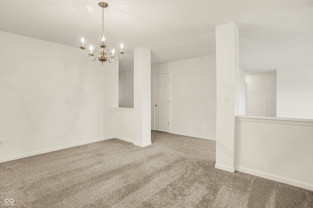 7156 Chemistry Ct, Indianapolis, IN 46239 - empty room with carpet, a chandelier, and baseboards
