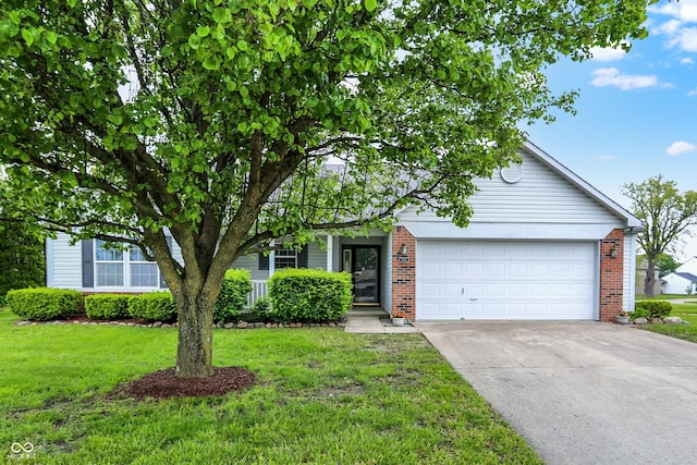 7156 Chemistry Ct, Indianapolis, IN 46239 - view of front of home with an attached garage, driveway, brick siding, and a front yard