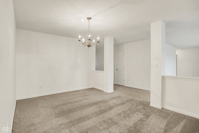 7156 Chemistry Ct, Indianapolis, IN 46239 - spare room with carpet floors, a chandelier, and baseboards