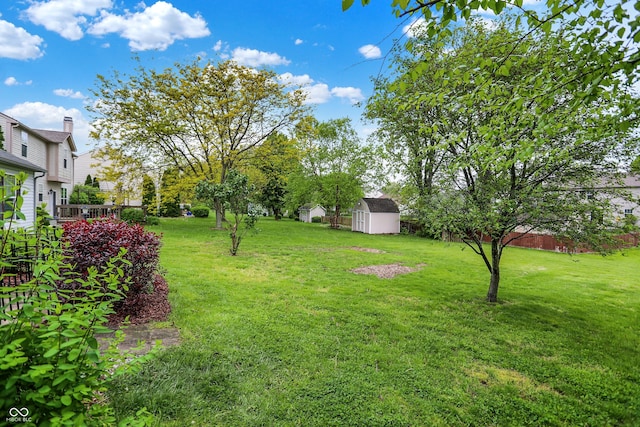 7156 Chemistry Ct, Indianapolis, IN 46239 - view of grassy yard with a storage shed and an outbuilding
