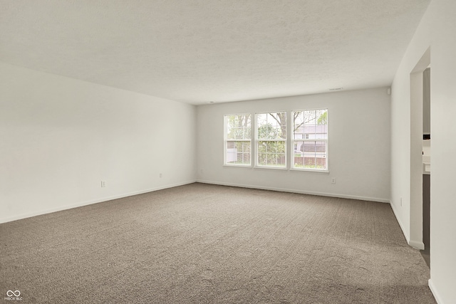 7156 Chemistry Ct, Indianapolis, IN 46239 - empty room with carpet, baseboards, and a textured ceiling