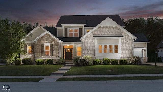 14003 Grannan Ln, Carmel, IN 46074 - view of front of property featuring a front lawn, stone siding, and an attached garage