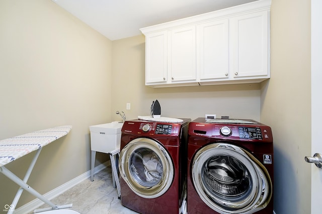 14003 Grannan Ln, Carmel, IN 46074 - laundry room with washing machine and clothes dryer, cabinet space, and baseboards