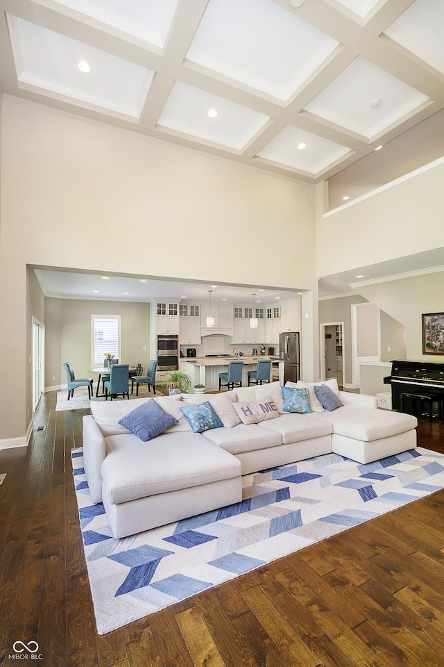 14003 Grannan Ln, Carmel, IN 46074 - living room with a towering ceiling, dark wood finished floors, coffered ceiling, recessed lighting, and baseboards