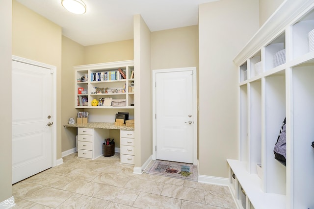14003 Grannan Ln, Carmel, IN 46074 - mudroom featuring built in study area and baseboards