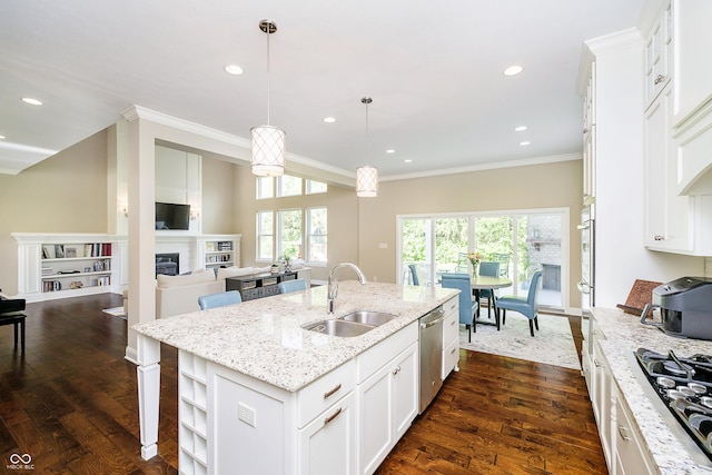 14003 Grannan Ln, Carmel, IN 46074 - kitchen with a sink, appliances with stainless steel finishes, crown molding, a kitchen island with sink, and dark wood-type flooring