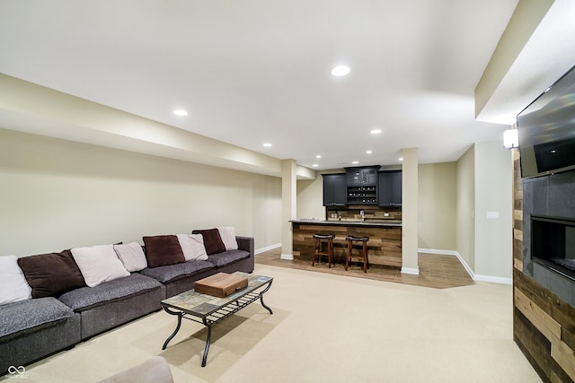 14003 Grannan Ln, Carmel, IN 46074 - living room with bar area, baseboards, recessed lighting, and light colored carpet