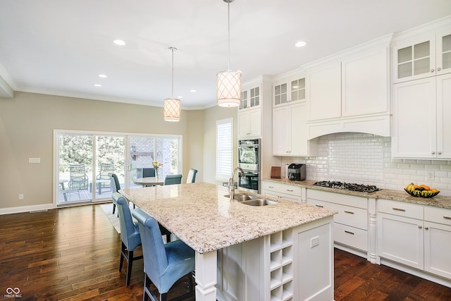 14003 Grannan Ln, Carmel, IN 46074 - kitchen with a sink, stainless steel appliances, decorative backsplash, dark wood-style flooring, and a kitchen island with sink