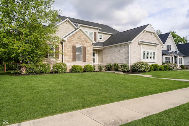 14003 Grannan Ln, Carmel, IN 46074 - view of front of home with a front lawn, stone siding, and brick siding