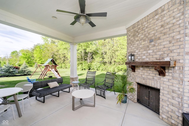 14003 Grannan Ln, Carmel, IN 46074 - view of patio / terrace featuring an outdoor brick fireplace, a playground, and ceiling fan