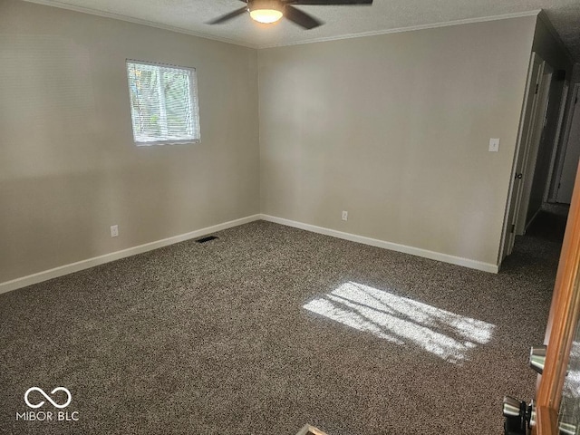 706 Alexander St, Greenwood, IN 46143 - spare room with ceiling fan, crown molding, carpet floors, and baseboards