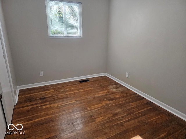 706 Alexander St, Greenwood, IN 46143 - empty room featuring dark wood-style flooring and baseboards