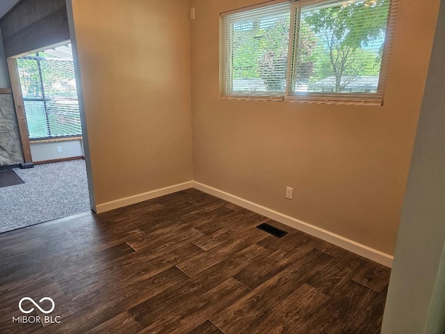706 Alexander St, Greenwood, IN 46143 - spare room with baseboards and dark wood finished floors