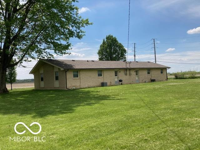 2940 W 53rd St, Anderson, IN 46011 - back of house with a yard and brick siding