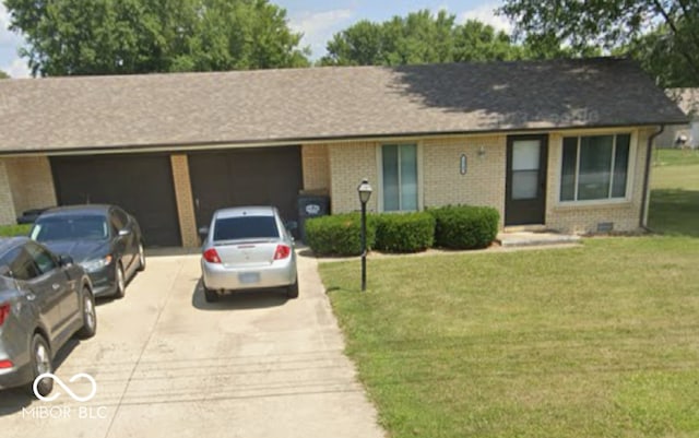 2940 W 53rd St, Anderson, IN 46011 - single story home with driveway, a garage, brick siding, and a front yard