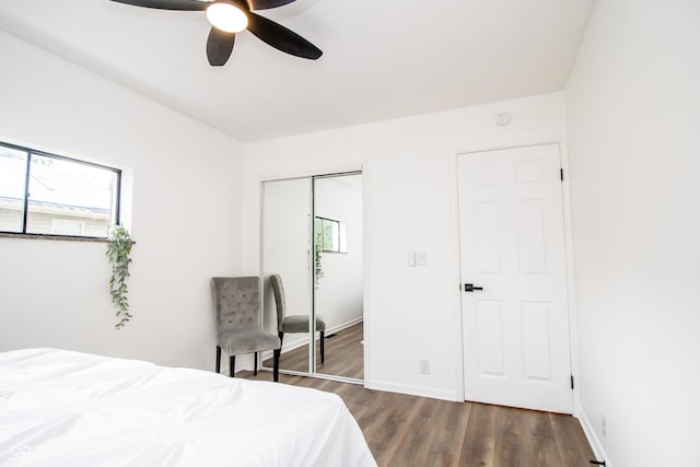 648 Market St, Hope, IN 47246 - bedroom featuring wood finished floors, a closet, ceiling fan, and baseboards
