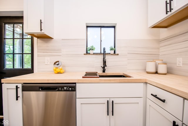 648 Market St, Hope, IN 47246 - kitchen featuring dishwasher, butcher block countertops, a sink, backsplash, and white cabinets