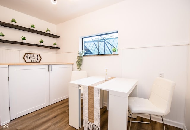 648 Market St, Hope, IN 47246 - dining area featuring wood finished floors and a wainscoted wall