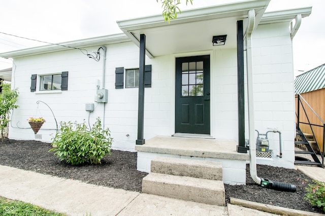 648 Market St, Hope, IN 47246 - property entrance featuring concrete block siding