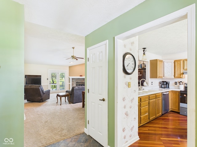 1356 S Catamaran Cir, Cicero, IN 46034 - kitchen with range with electric stovetop, stainless steel dishwasher, a sink, a ceiling fan, and baseboards